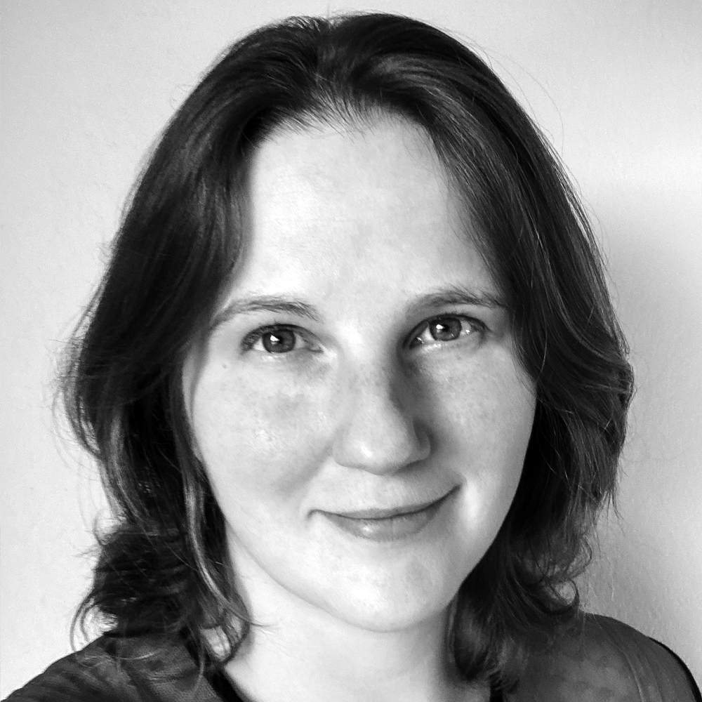 Professional headshot of Kat Messing