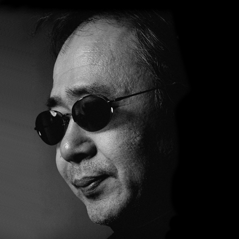 Professional headshot of Yoshiaki Kawajiri